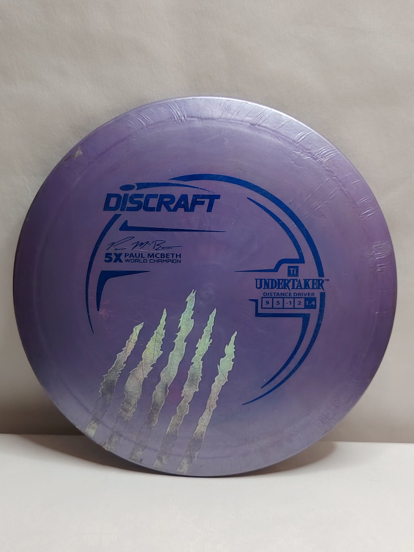 Discraft Titanium Undertaker – Paul McBeth Signature, Harmaa / Liila, n. 173 g, Kunto: A-