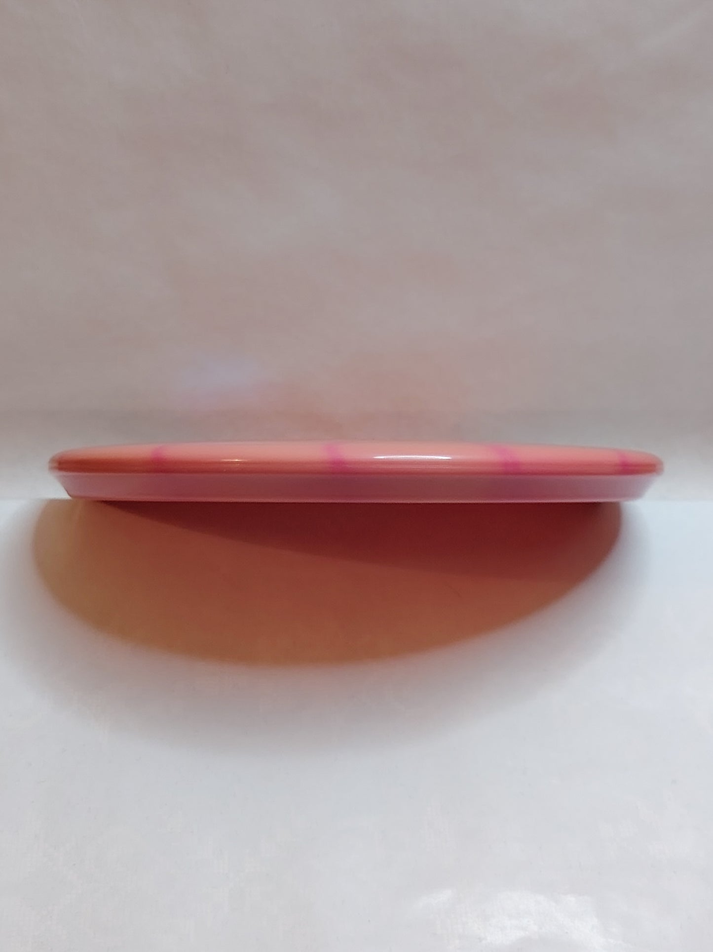 Discmania Lux Vapor P4 – Mini Razor Claw Stamp, Oranssi/Pinkki, 175 g, Kunto: Käyttämätön
